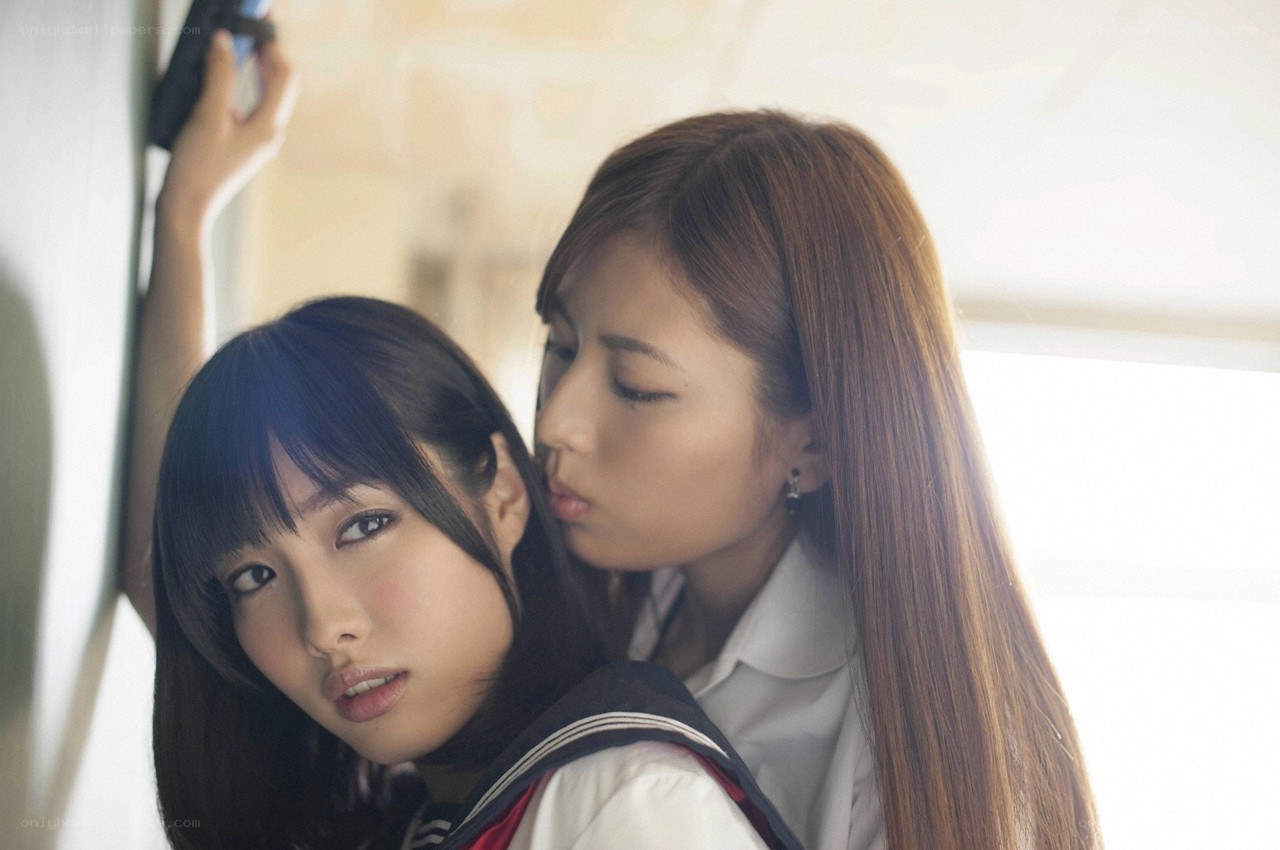 Two schoolgirls in a train