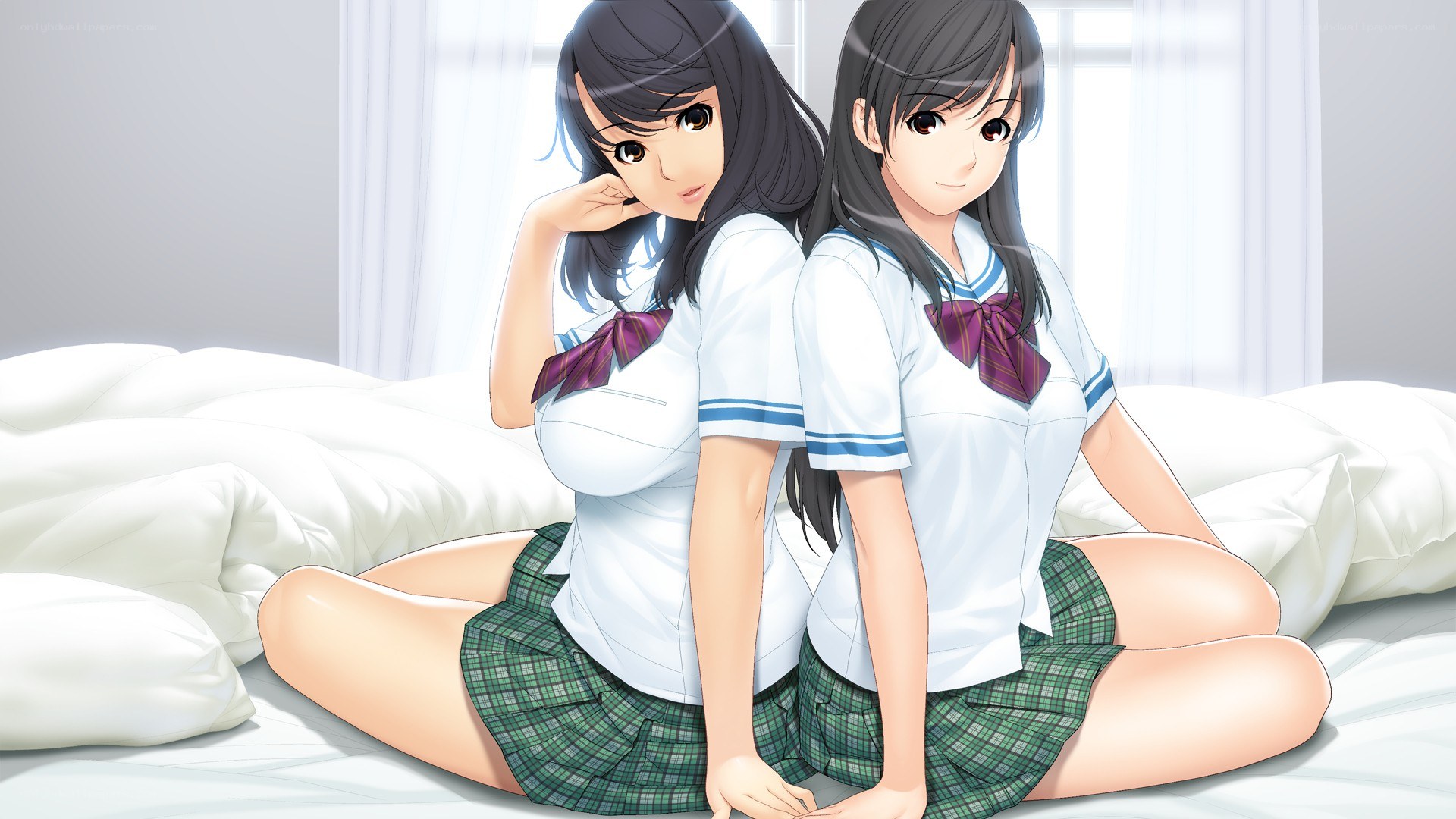 two schoolgirls on a bed