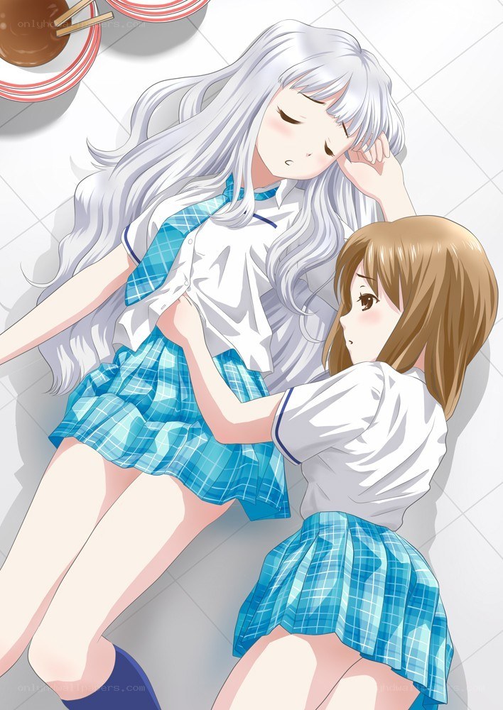Two schoolgirls resting on floor
