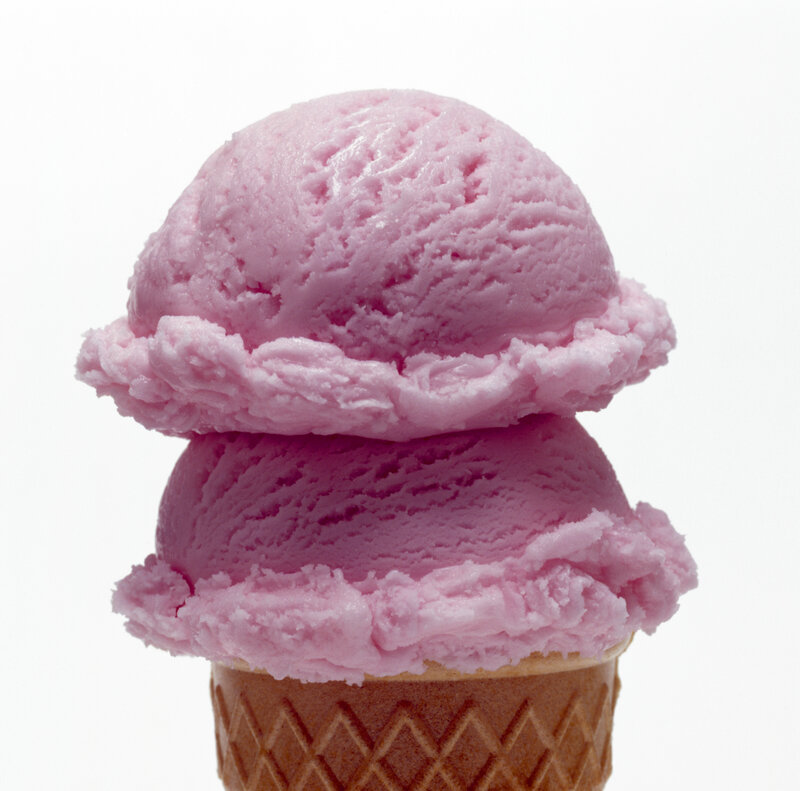 Two scoops of pink ice cream