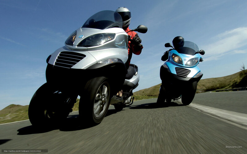 Two scooters on a road