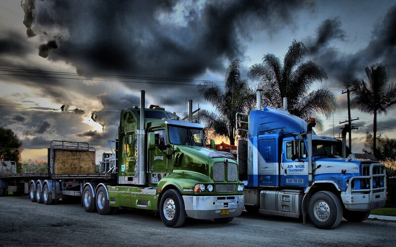 Two Semi-trucks Parked — Green, Dramatic