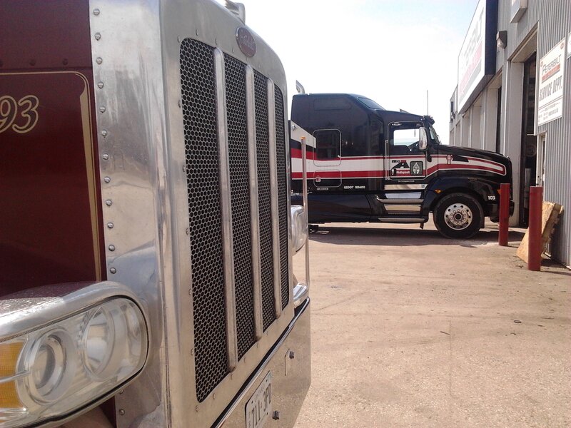 Two Semi-trucks — Silver