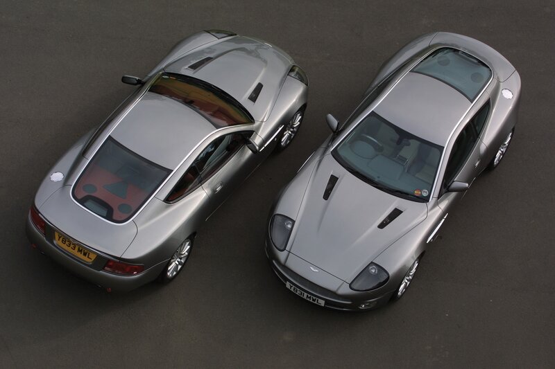 Two silver Aston Martin cars