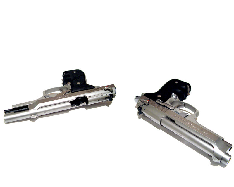 two silver handguns