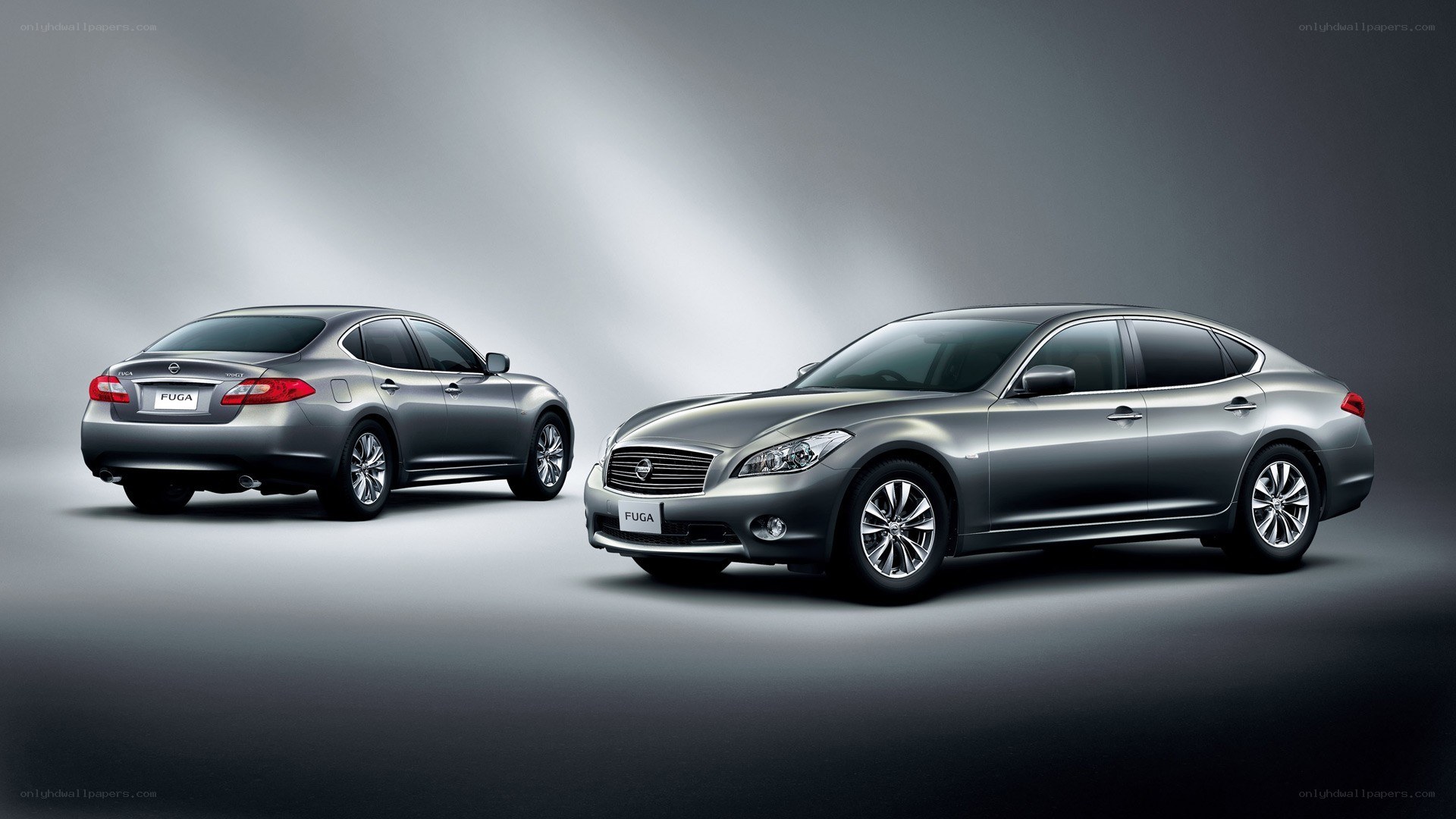 Two silver Nissan Fuga sedans