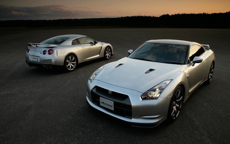 Two silver Nissan GT-R cars