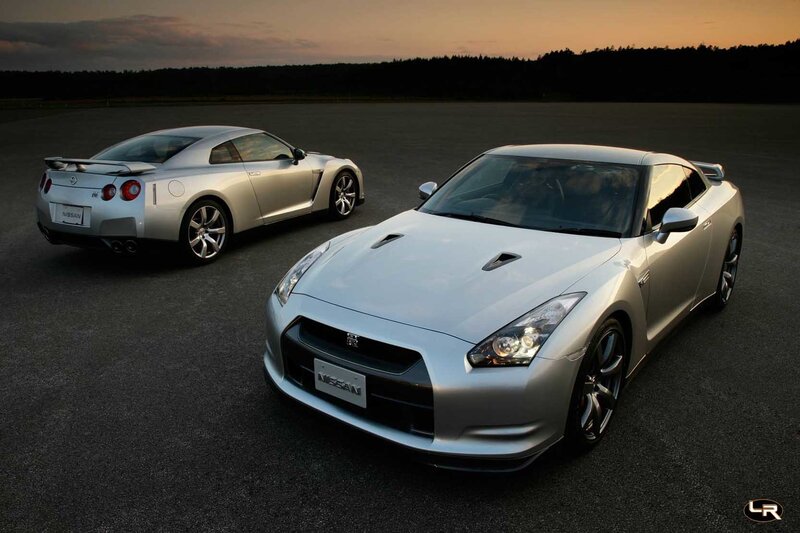 Two silver Nissan GT-R cars