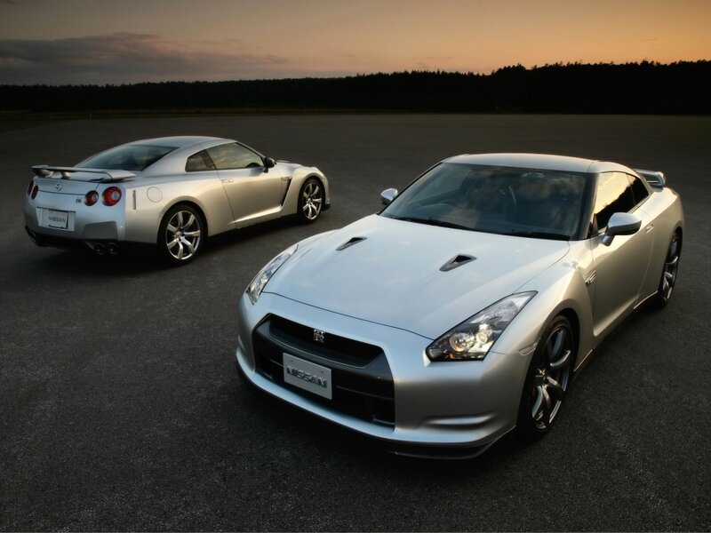 Two silver Nissan GT-R cars