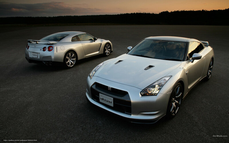 Two silver Nissan GT-R cars