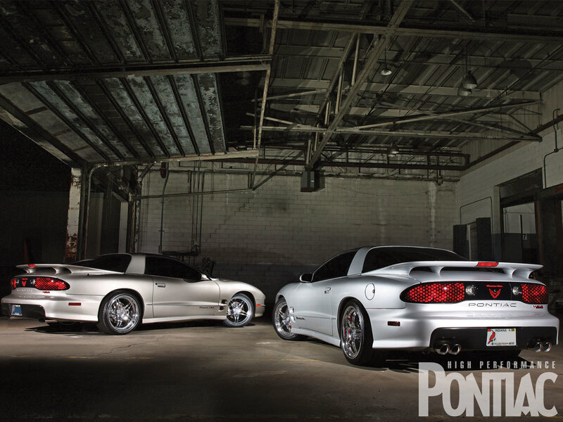 Two Silver Pontiac Cars