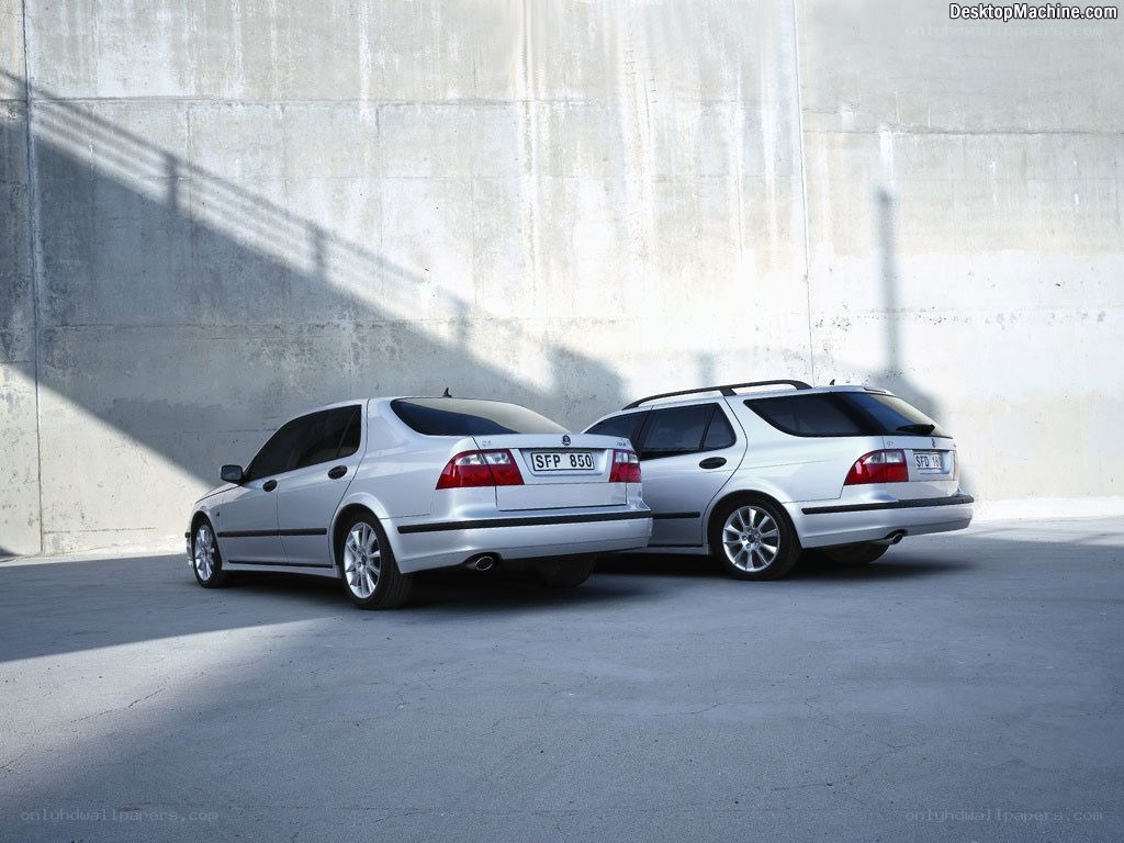 Two silver Saab cars