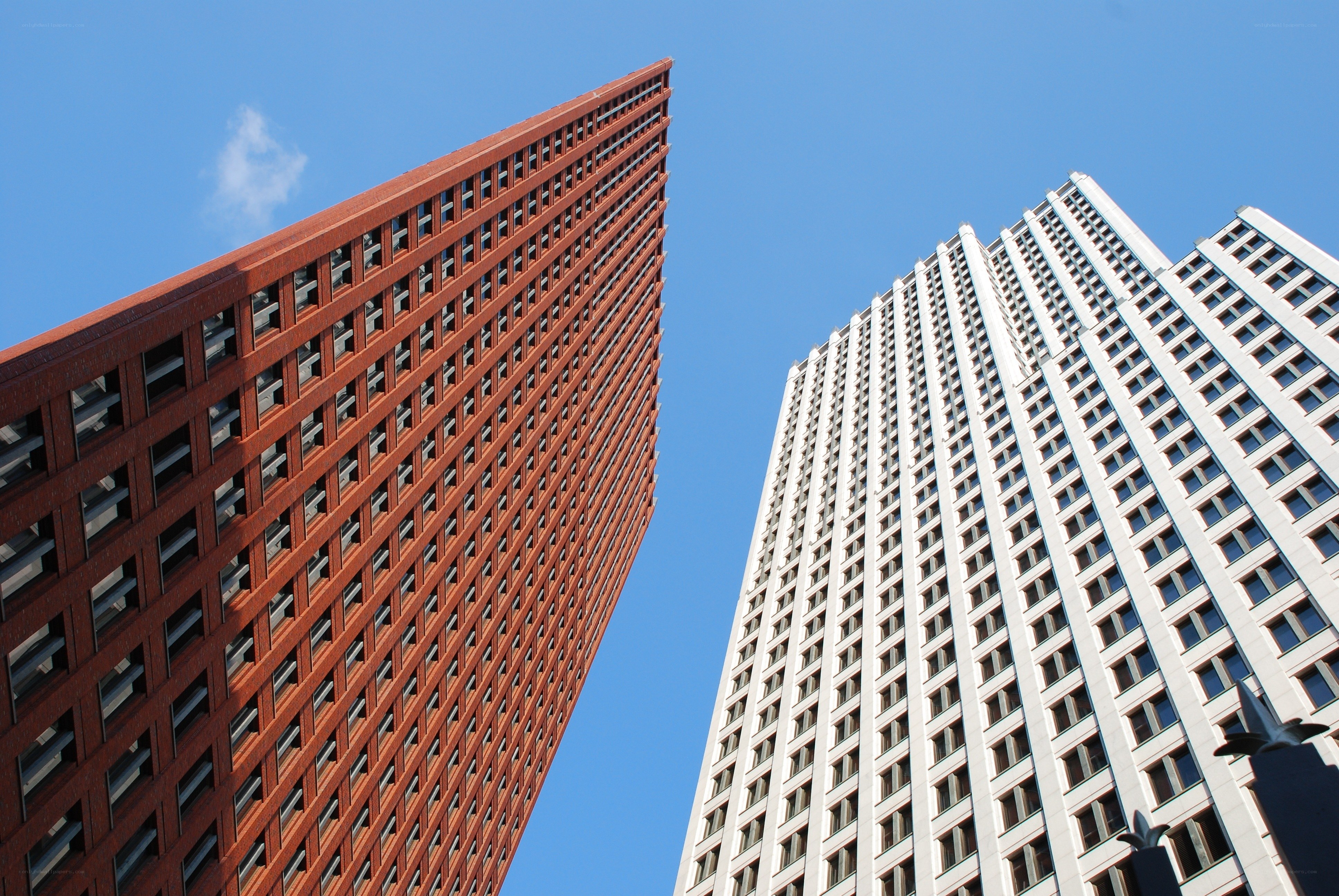 Two skyscrapers against blue sky