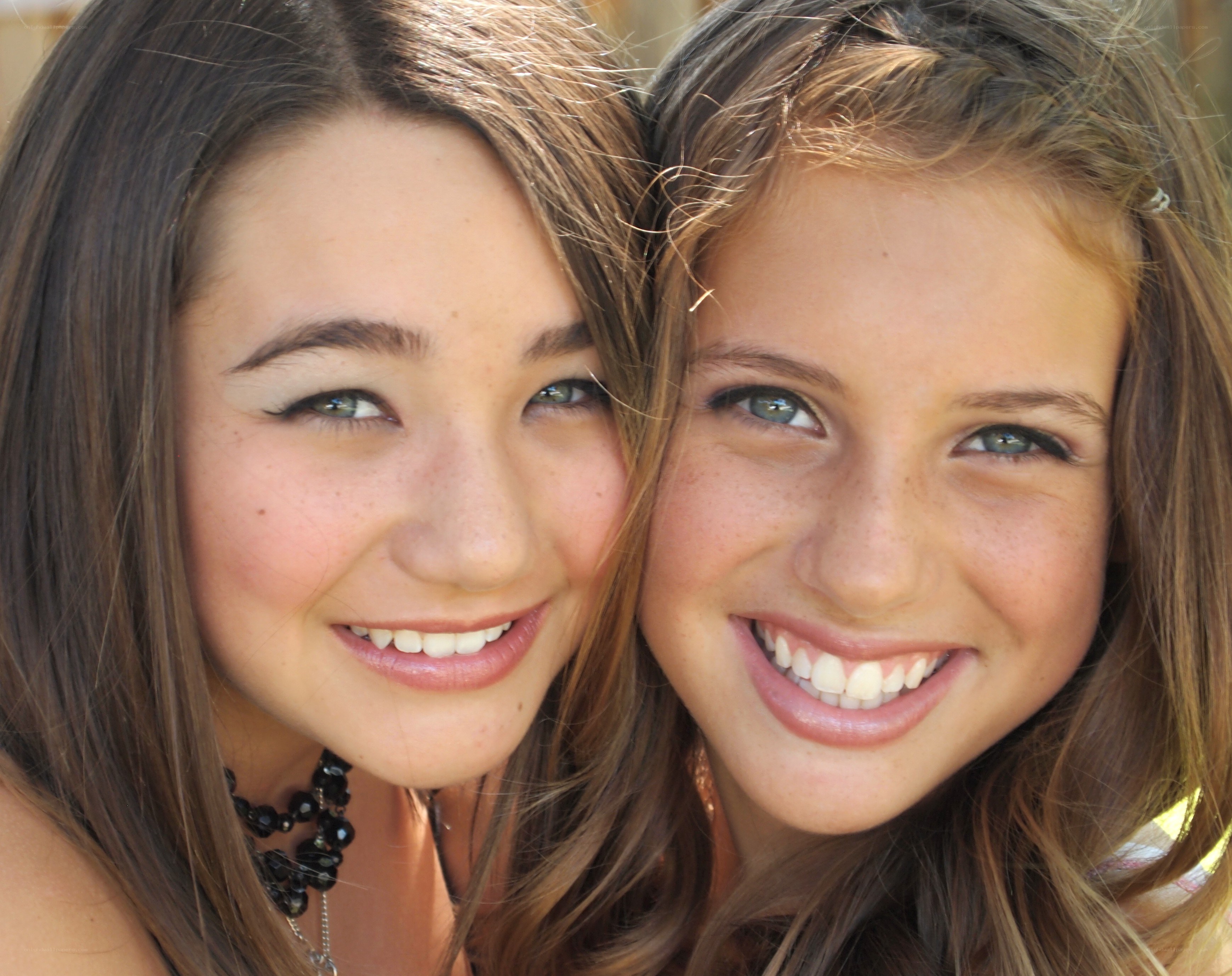 two smiling girls together