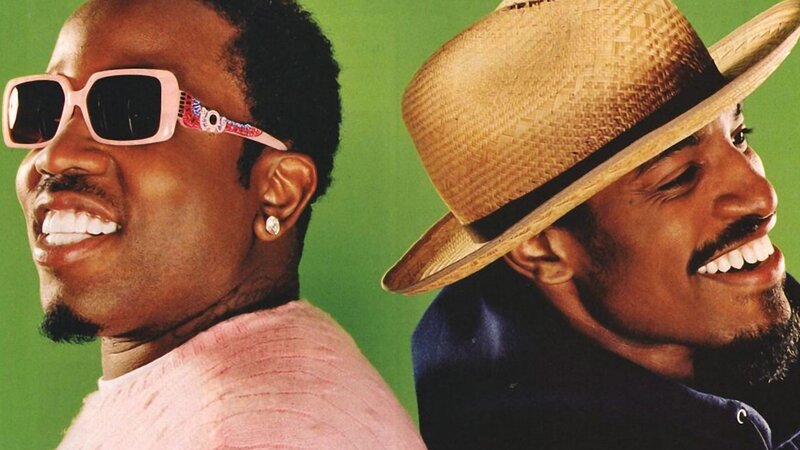two smiling men in sunglasses