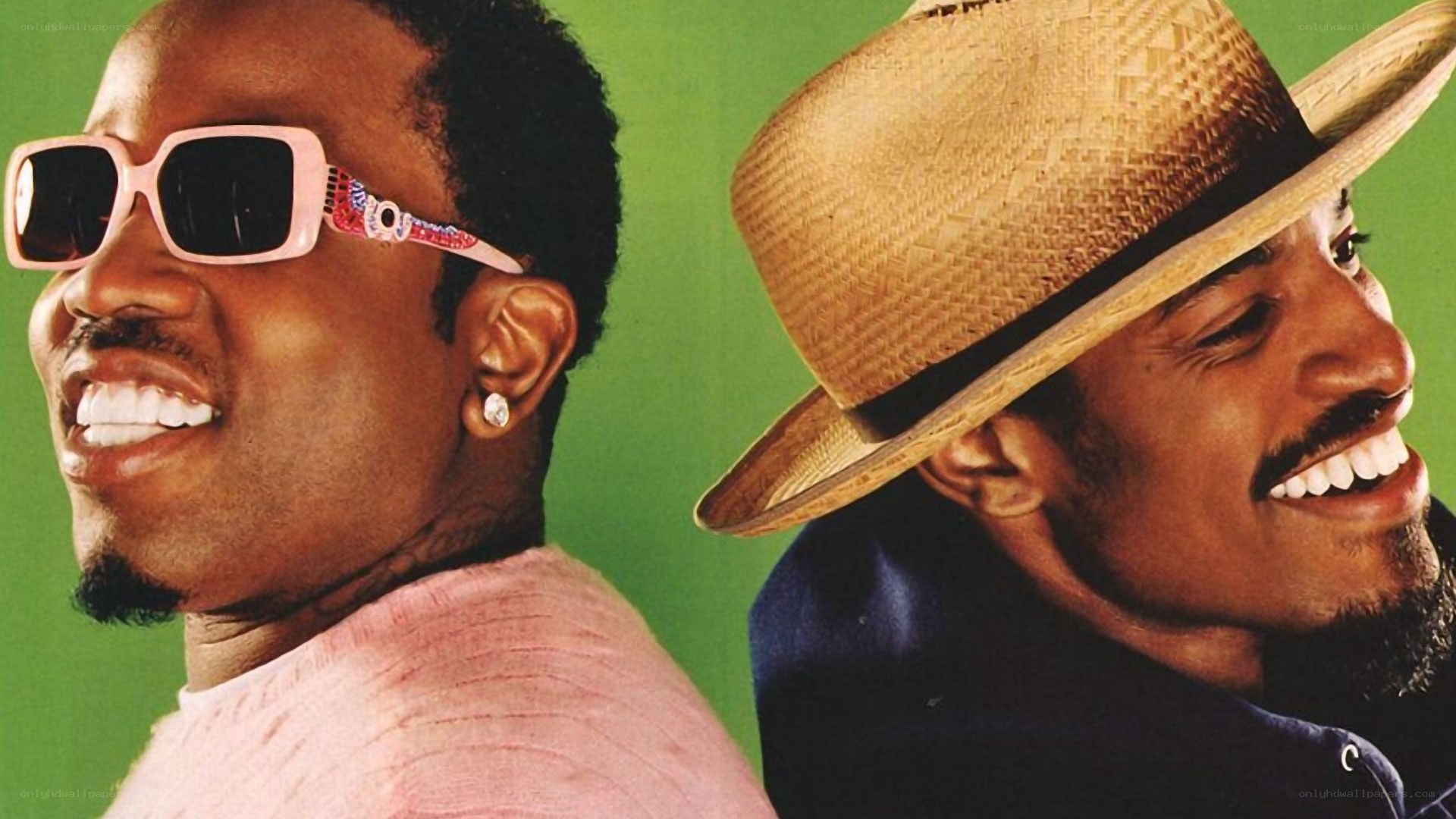 two smiling men in sunglasses