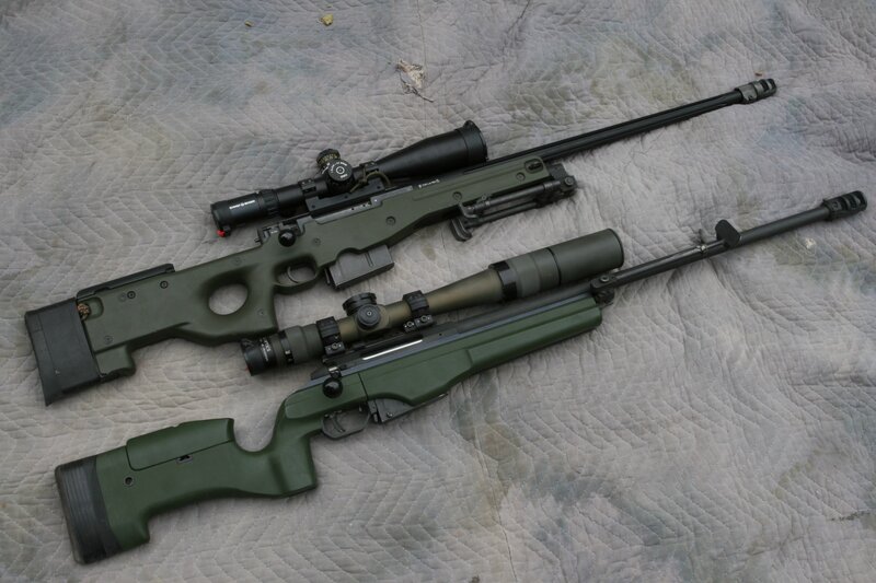 Two sniper rifles on a quilt
