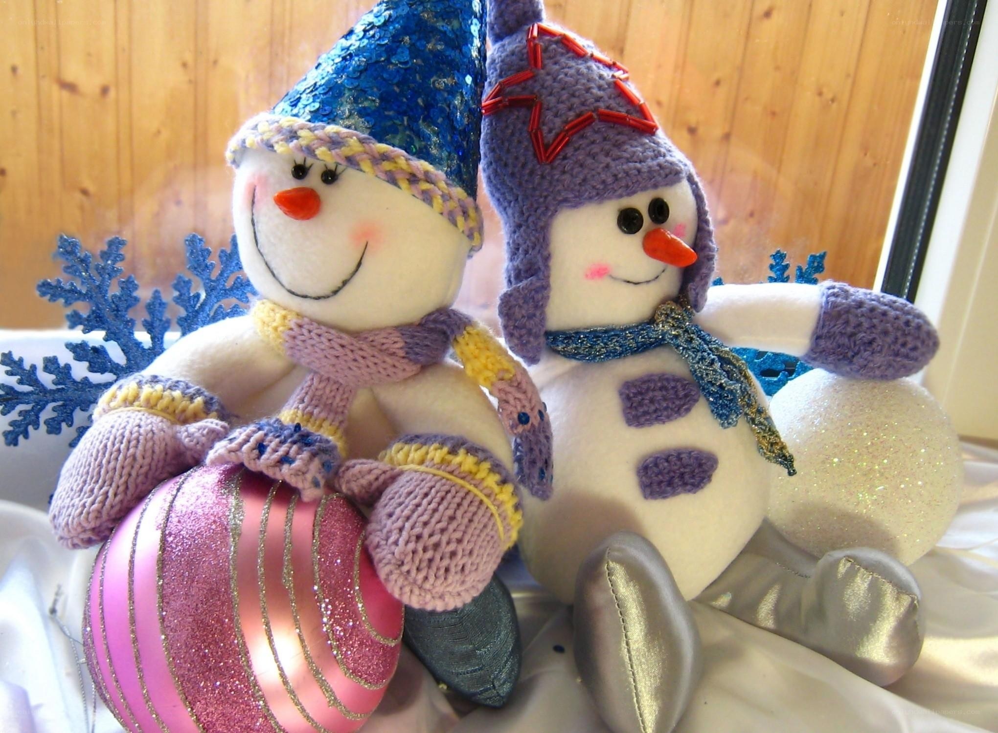 Two snowman plush toys