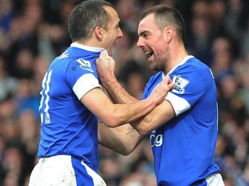 Two Soccer Players Celebrating — Blue