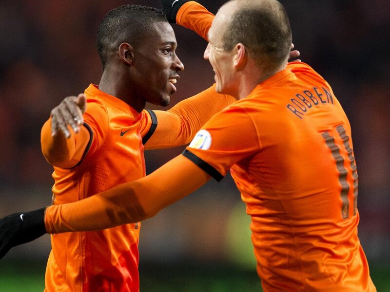 Two Soccer Players Celebrating — Orange