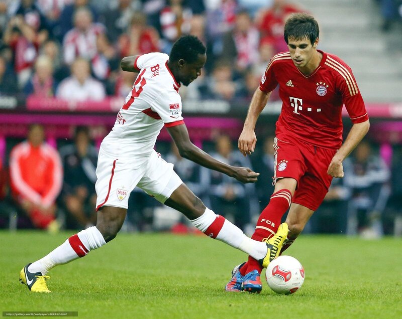 Two Soccer Players Competing — Green, Competitive, Afternoon