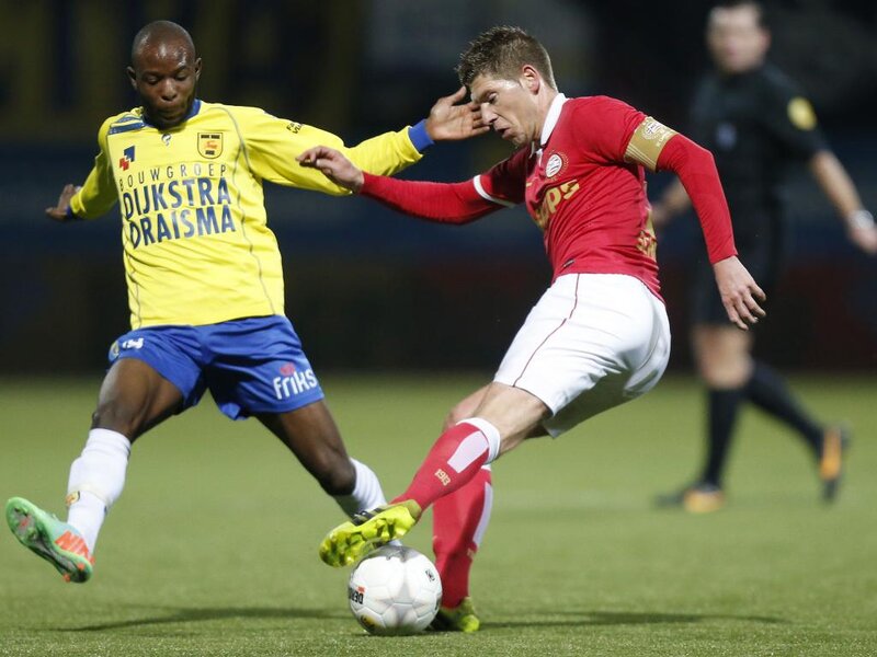 Two Soccer Players Competing — Green, Competitive