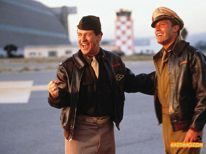 Two soldiers laughing on airfield