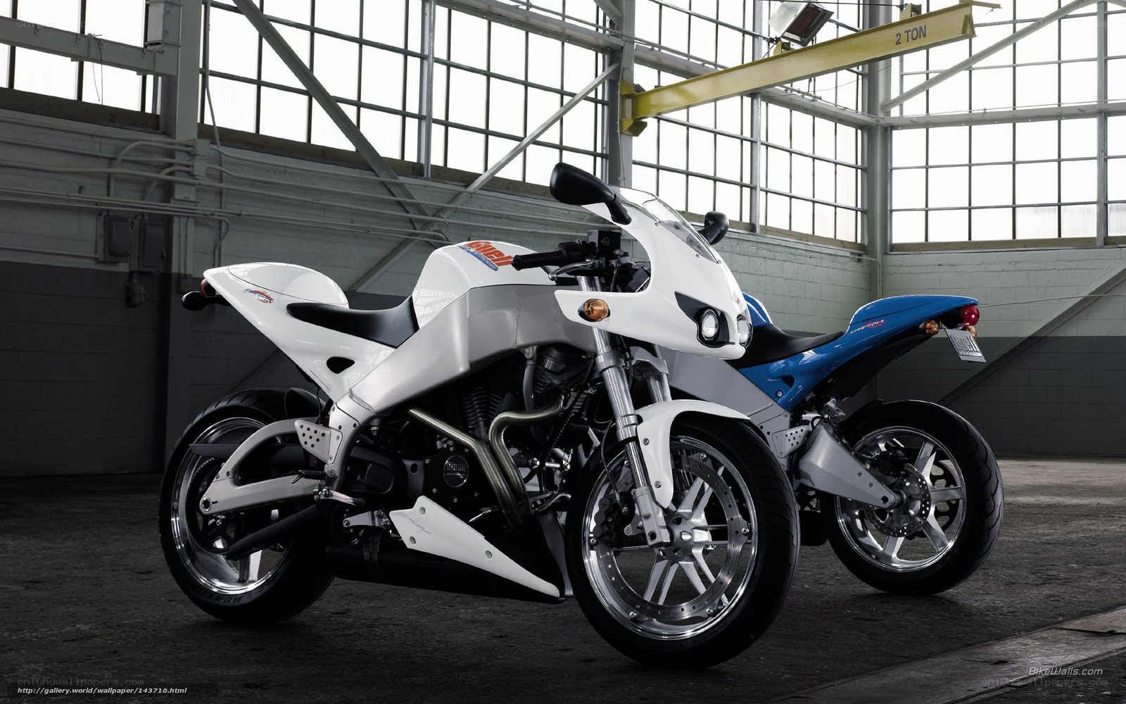 Two sport motorcycles in a warehouse