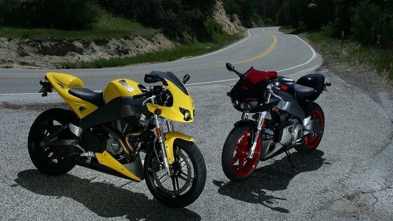 Two sport motorcycles on a road