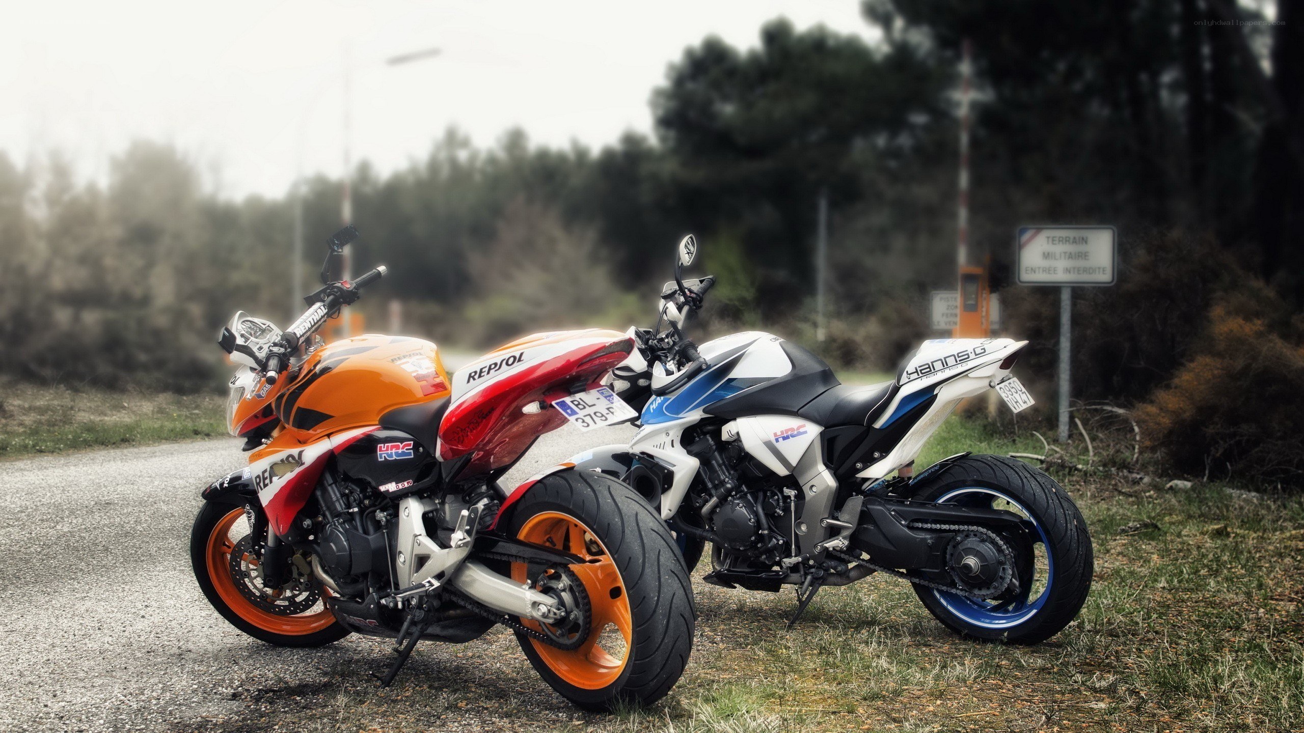 Two sport motorcycles parked