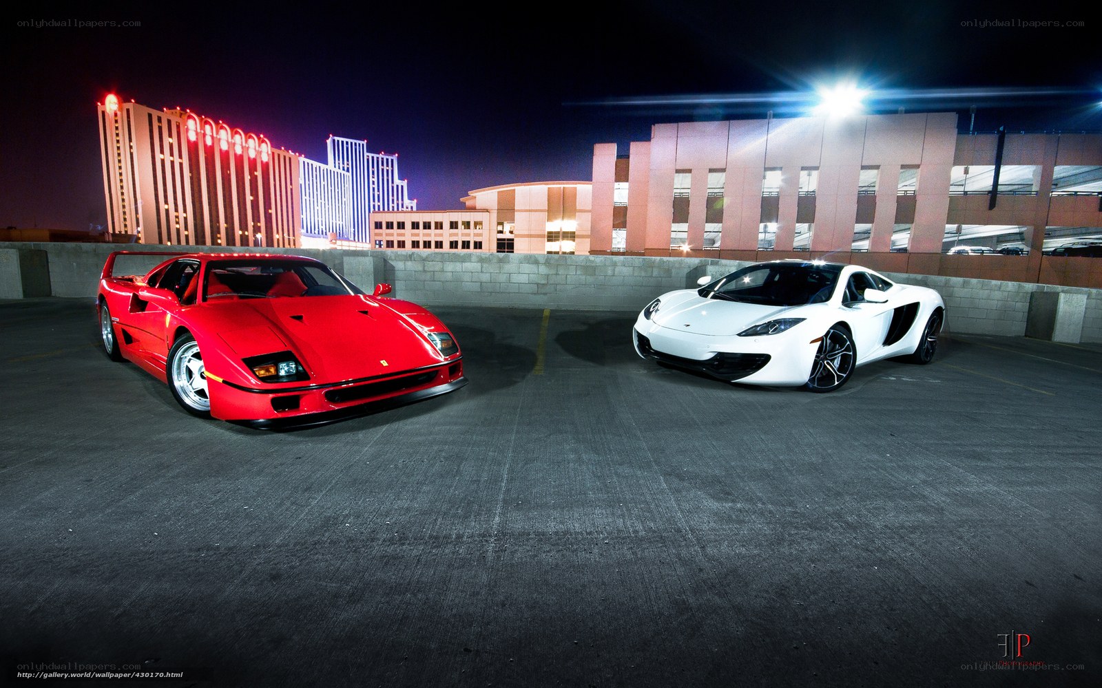 Two sports cars at night