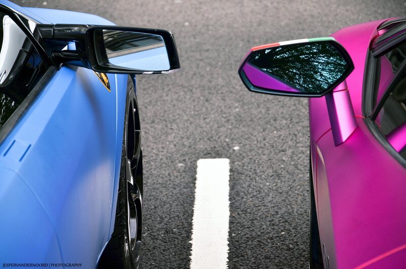 Two sports cars facing each other