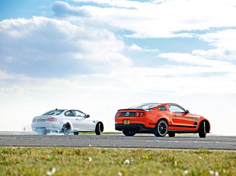 Two sports cars on a runway