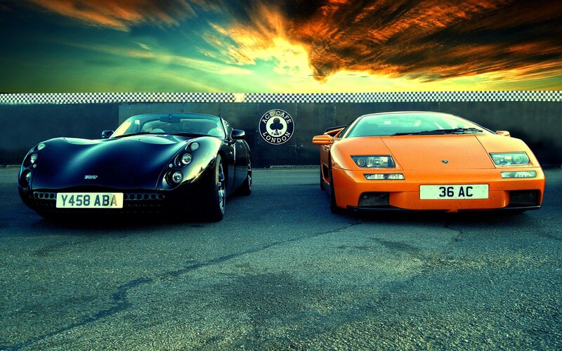 Two Sports Cars — Orange, Dramatic, Sunset