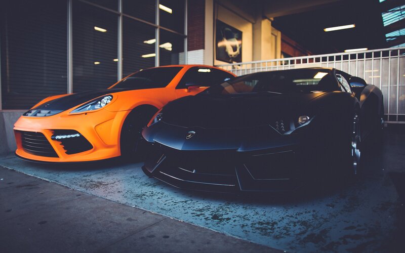 Two sports cars parked