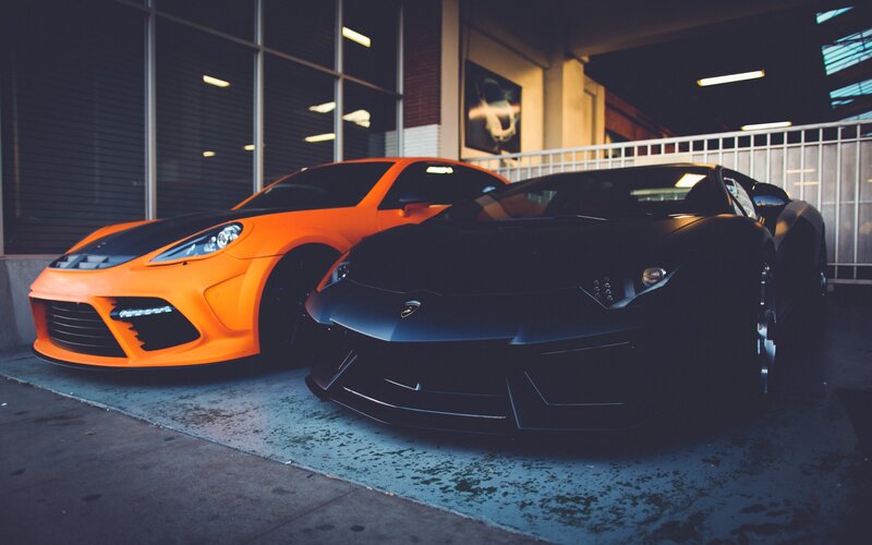 Two sports cars parked