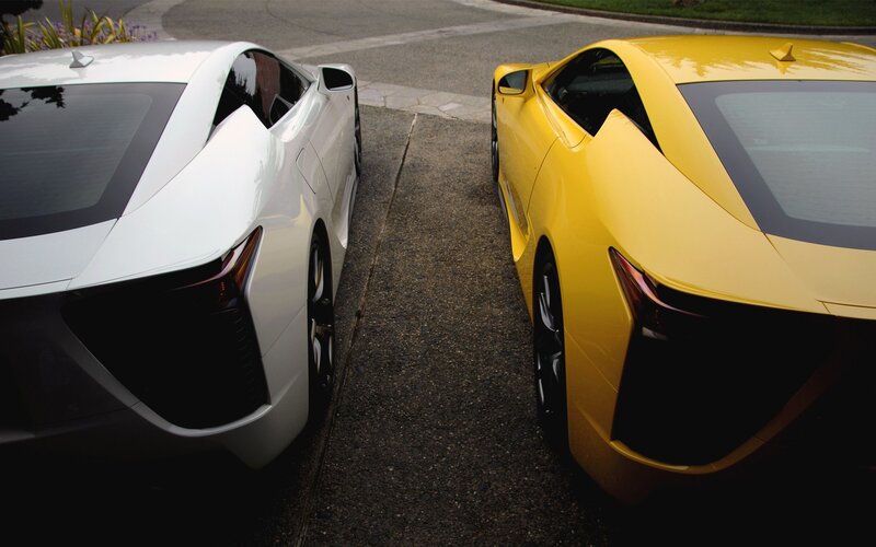 Two sports cars parked side by side