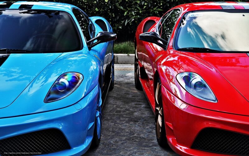 Two sports cars parked side by side