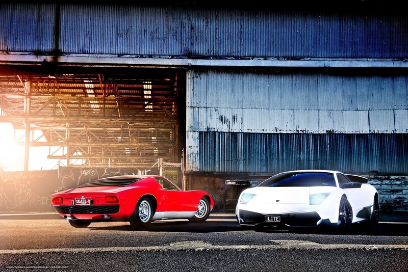Two Sports Cars — Red, Dramatic, Sunset
