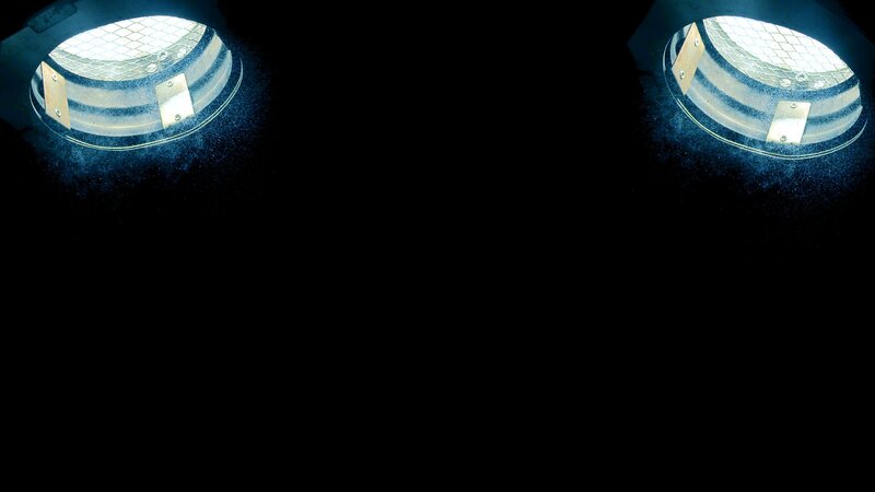 two spotlights in darkness