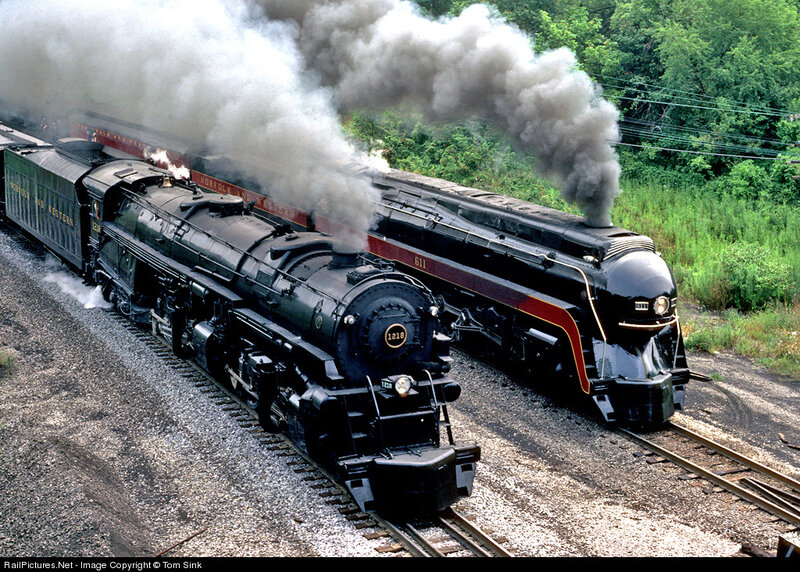 Two steam locomotives on tracks