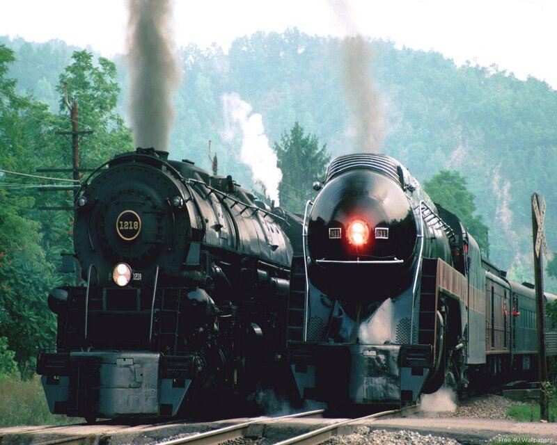 Two steam trains on tracks