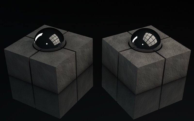 two stone cubes with black spheres