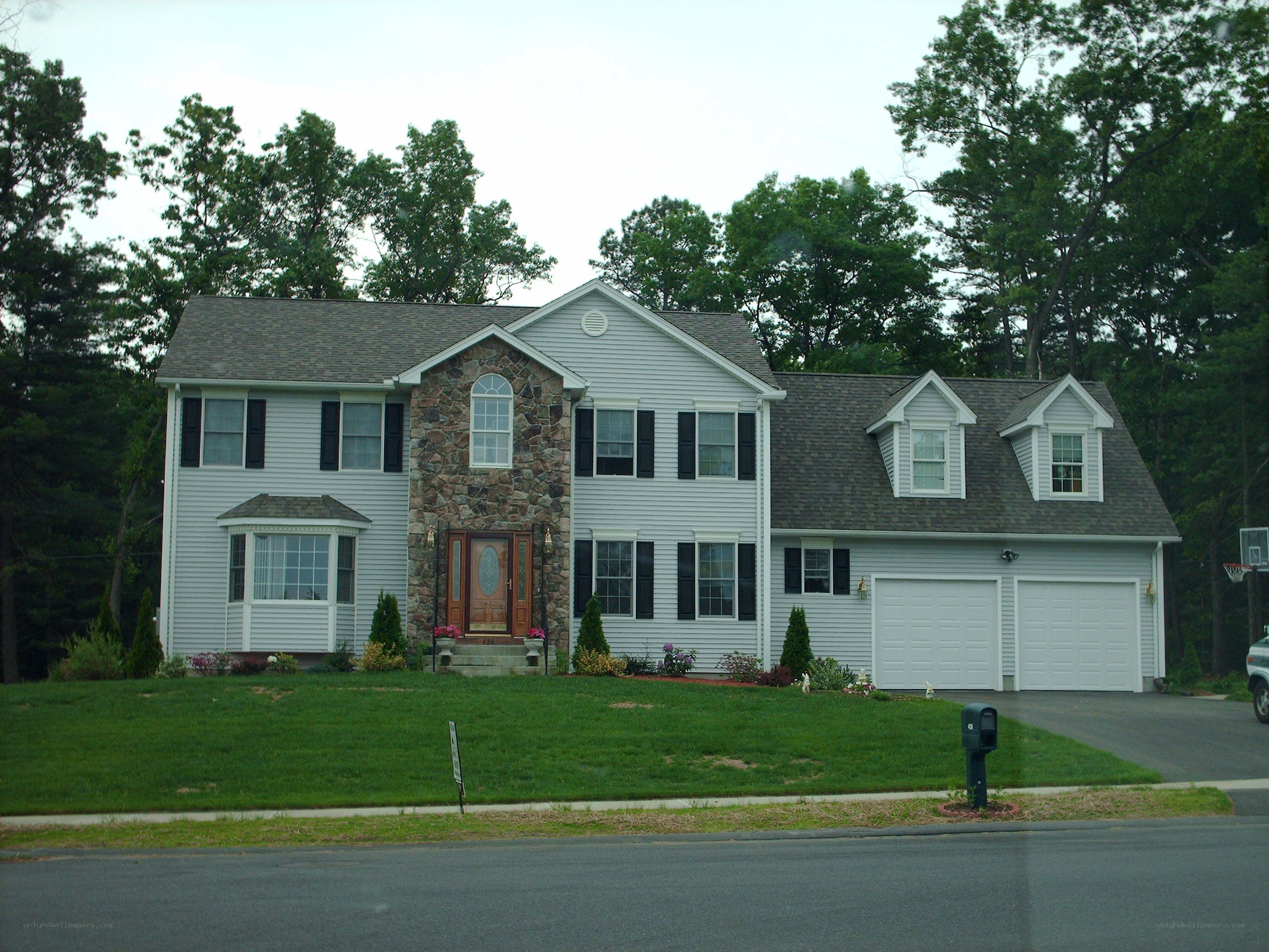 two-story house with stone facade