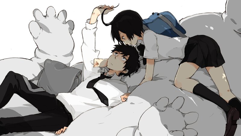 Two students on a bed