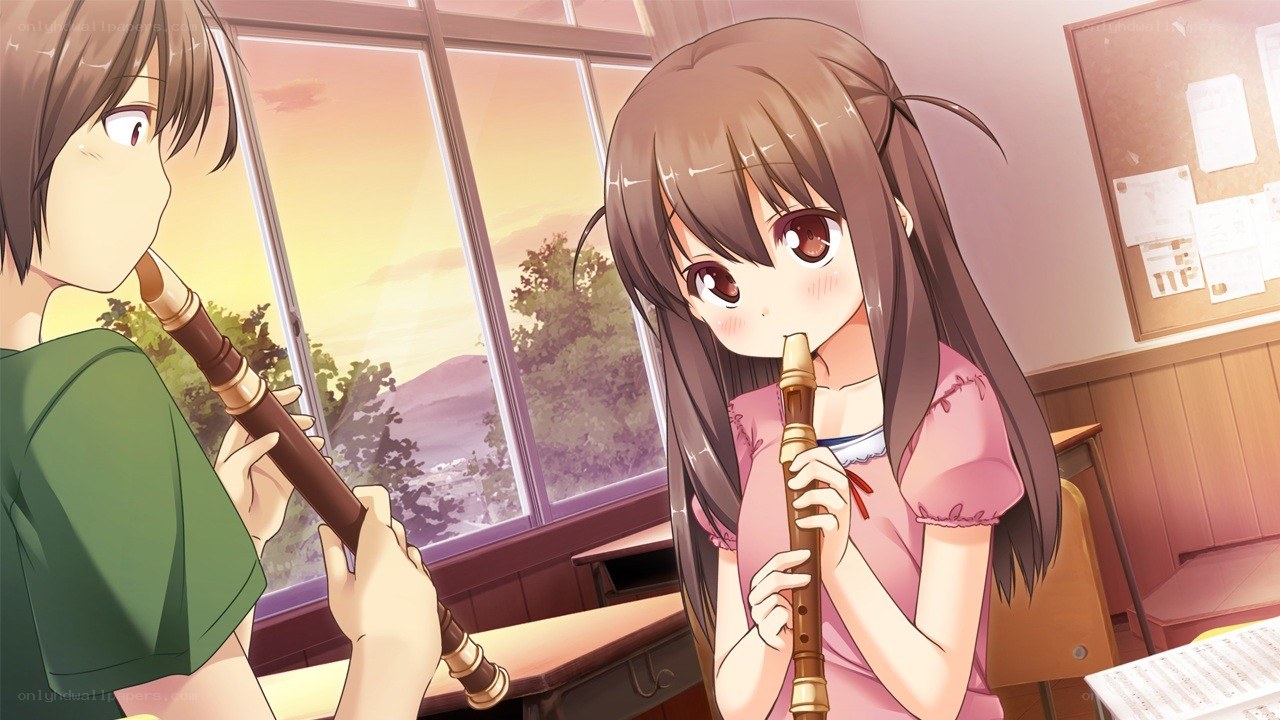 Two students playing recorders