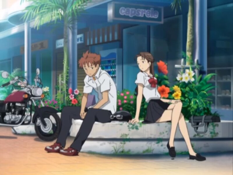 Two Students Sitting — Blue