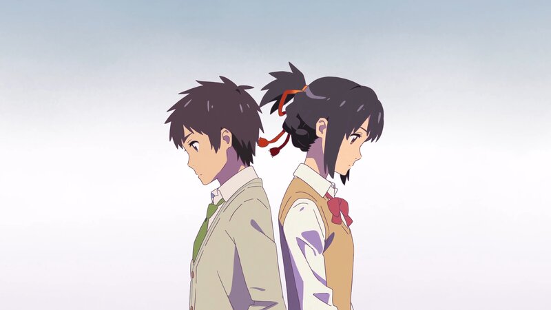 Two Students Standing Back to Back — White