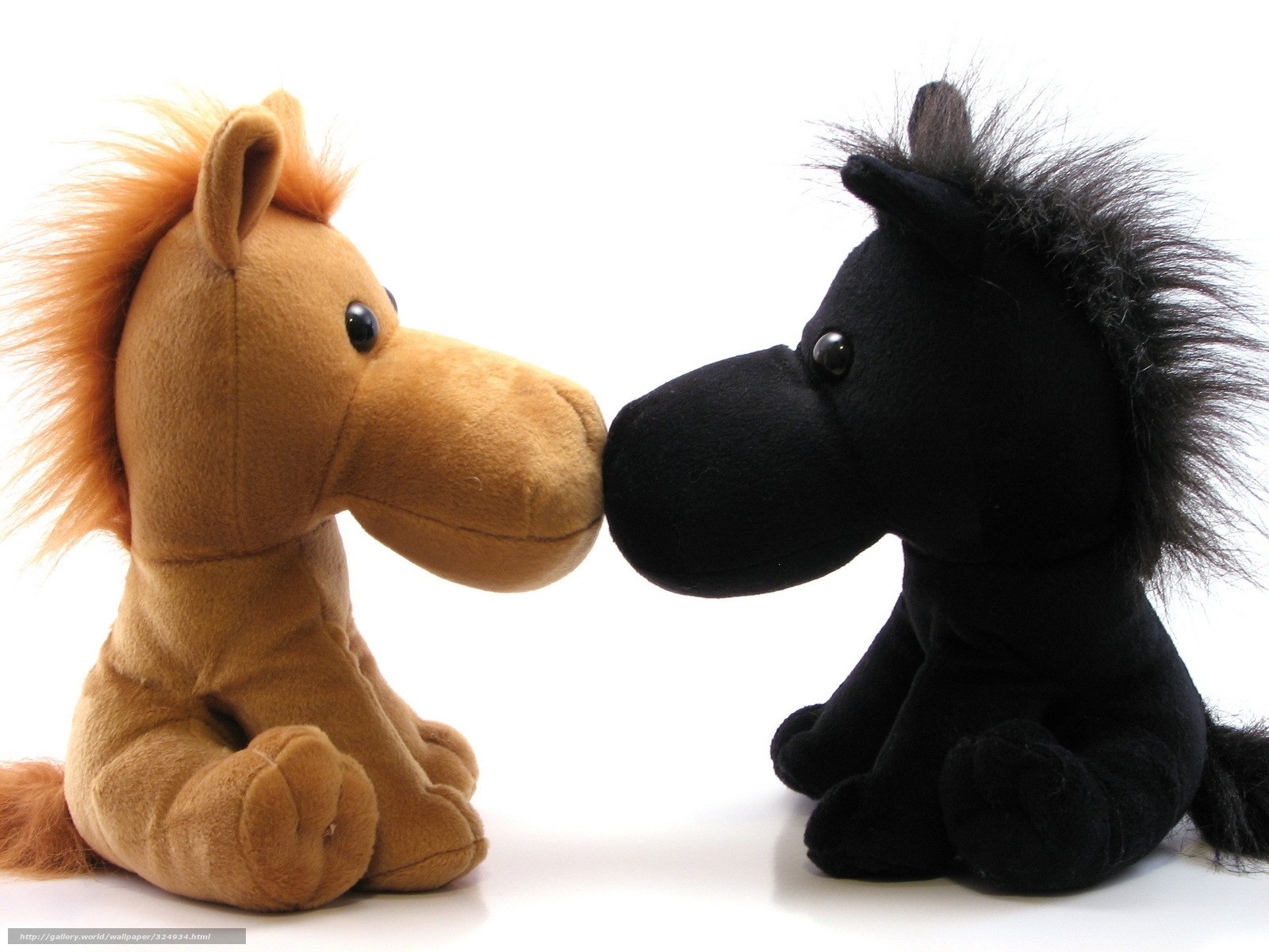 Two stuffed horses facing each other