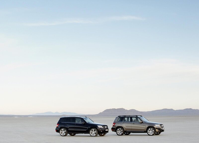 Two SUVs in a desert landscape